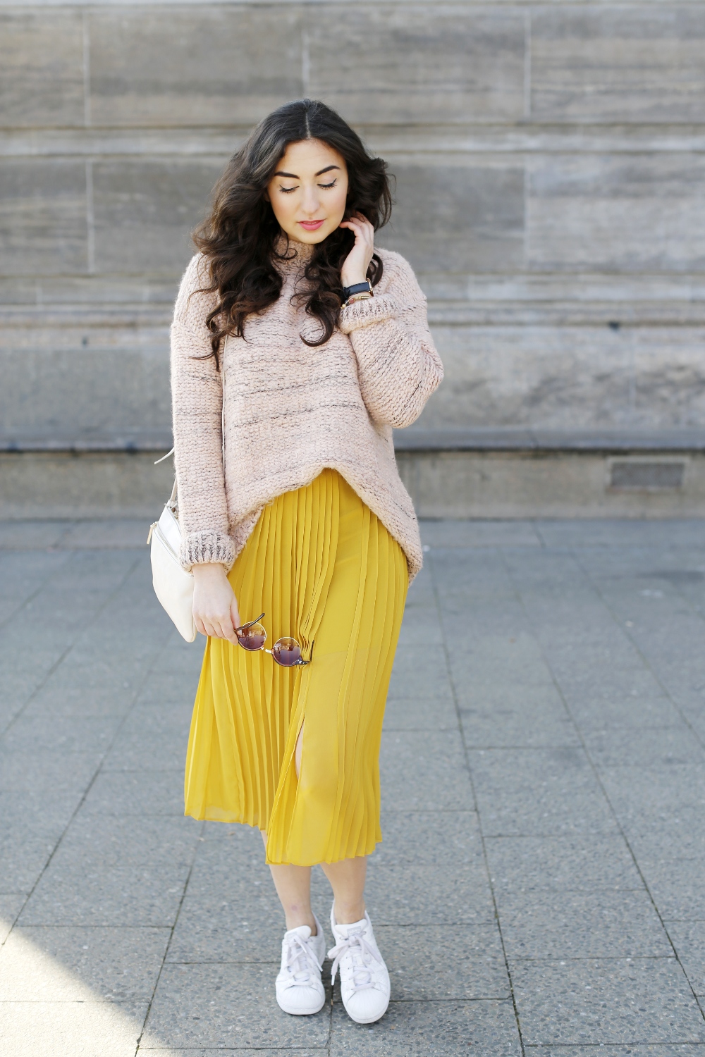 Spring look with soft candy colours including a Yellow Silk Skirt from Stefanel, a chunky blush sweater from mango and adidas superstars sneakers.